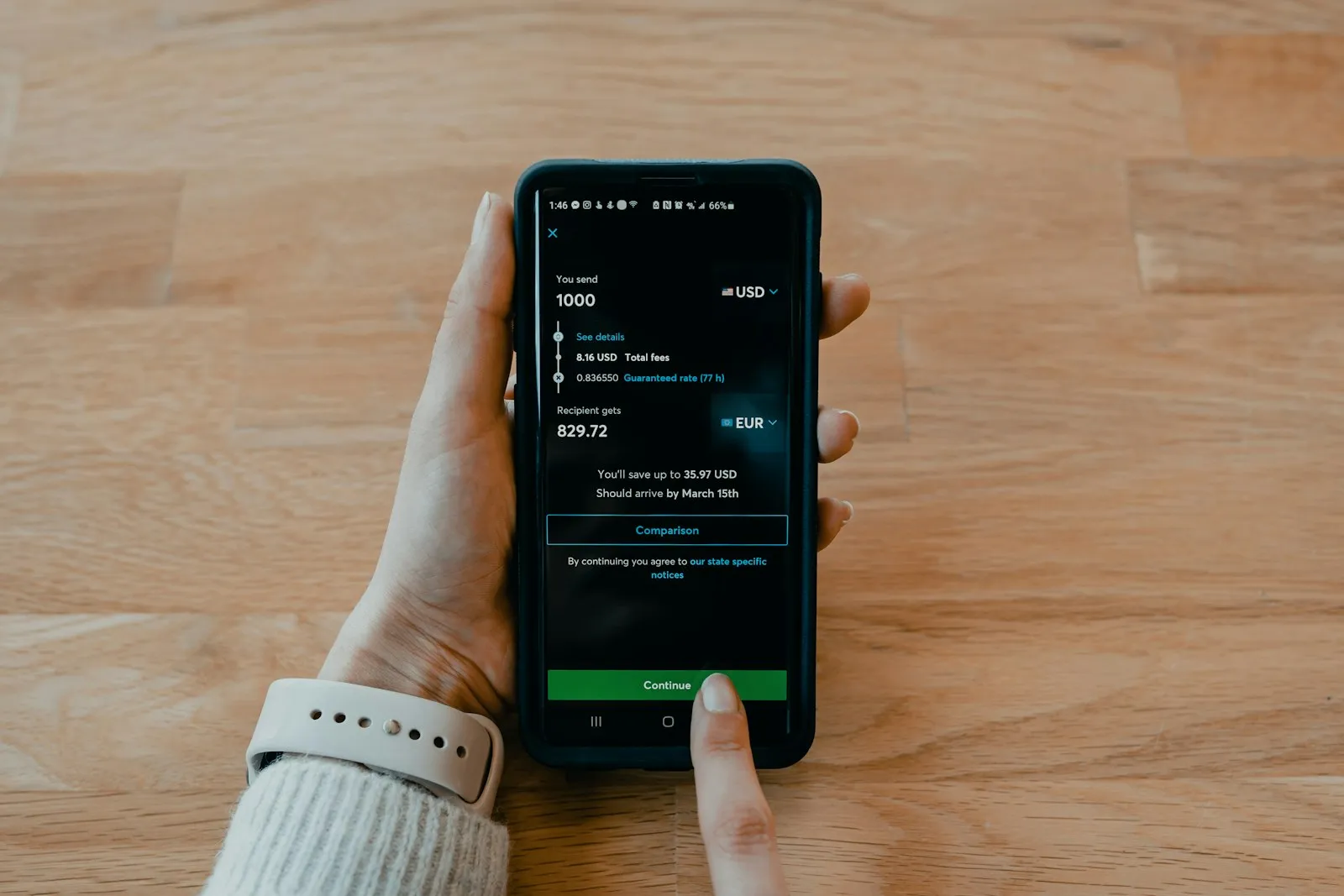 Person sending money abroad from an app on their phone
